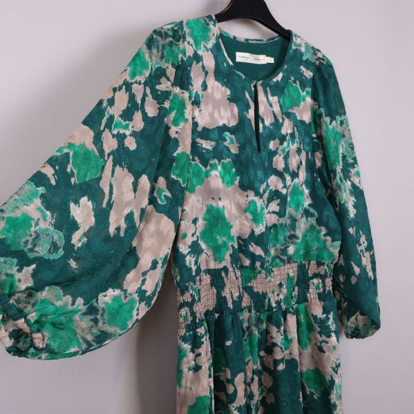 Detaljer av mönster och ärm