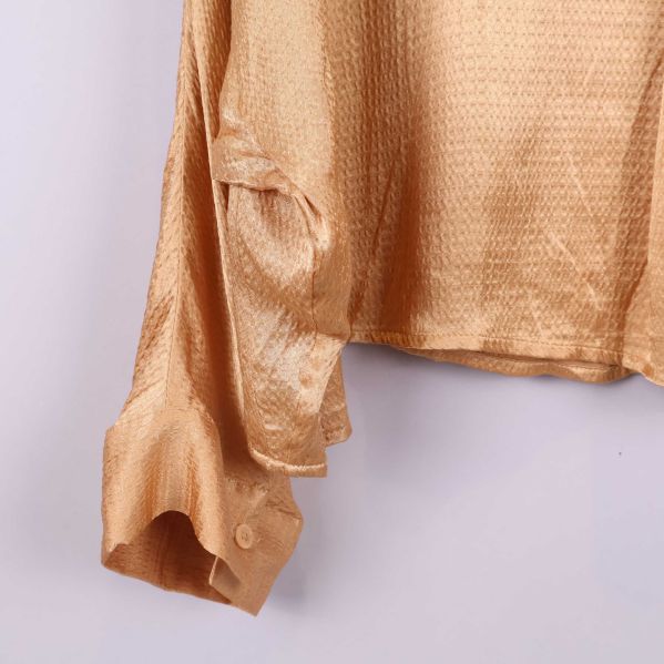 Manschett med knapp i matchande färg