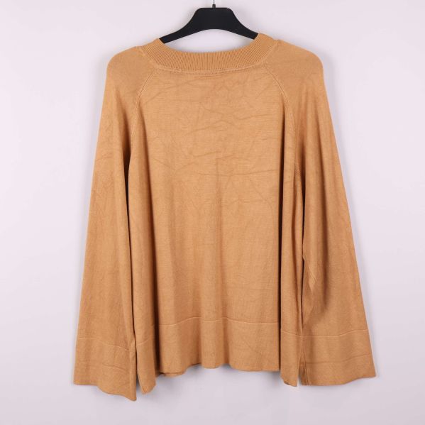 Breda ärmar och enkel design