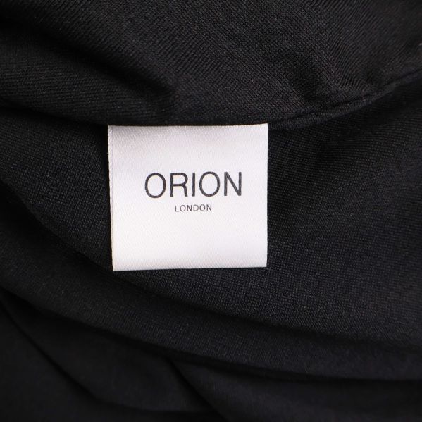 Materialetikett med texten Orion London