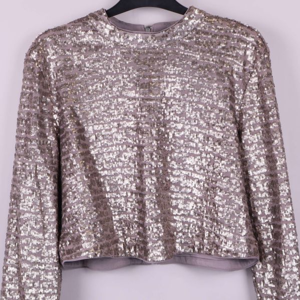 Närbild på paljettoppens glittrande framsida