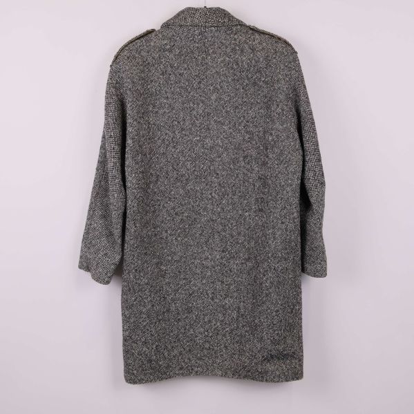 Baksidan av kappan med fiskbensmönster