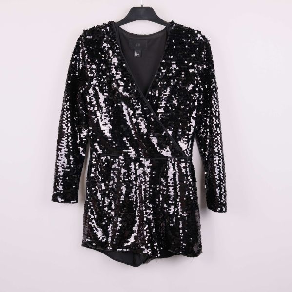 Helbild på svart glittrig jumpsuit med lång ärm på galge