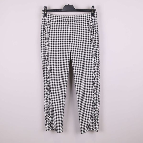 Rutiga byxor med volanger framtill