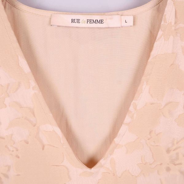 V-ringning och varumärke Rue de Femme