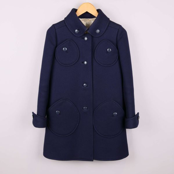 Kappa med stora runda fickor