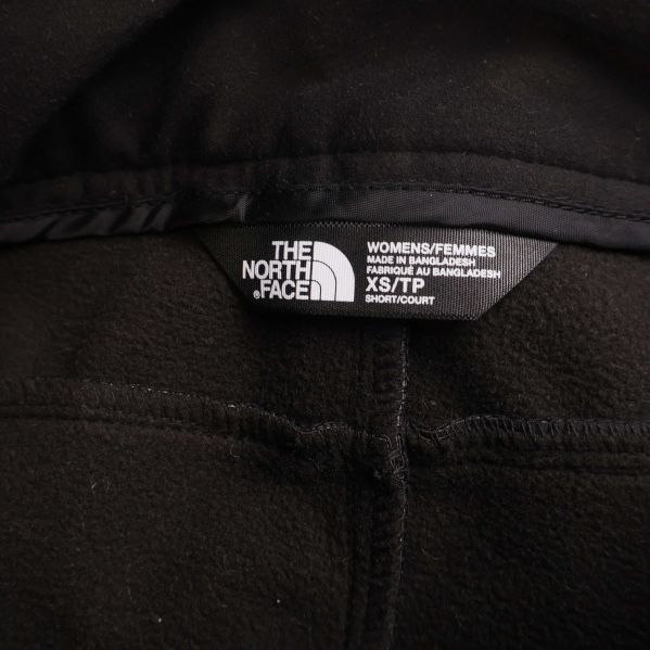 Etikett med The North Face XSTP storlek och dammodell