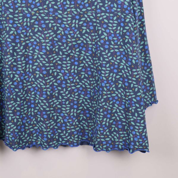 Närbild på vågig avslutning nertill på toppen