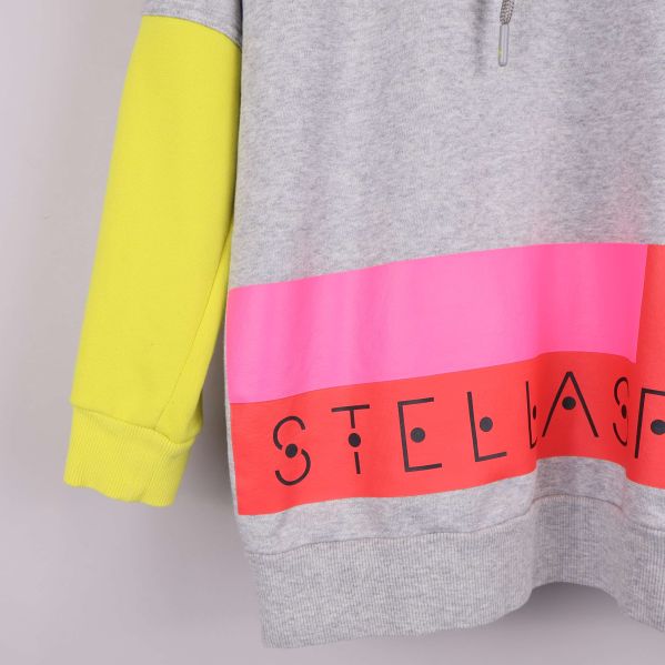 Nederdel av hoodie med rosa och korallfärgade block