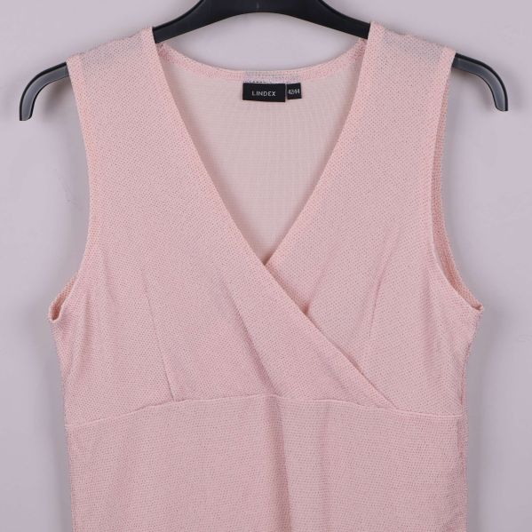 Närbild ljusrosa omlottlinne vid ringningen