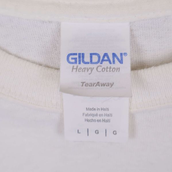 Etikett visar Gildan Heavy Cotton och storlek L