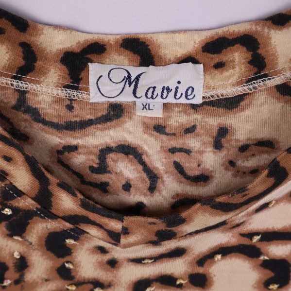 Närbild av etikett med texten Marvie XL