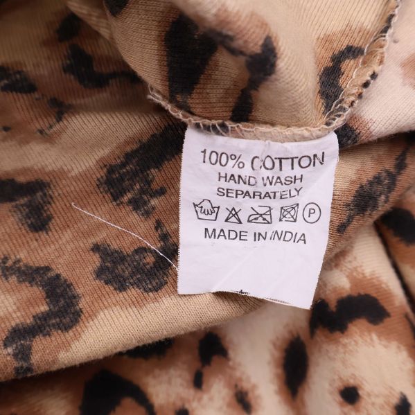 Tvättlapp med information om 100% bomull