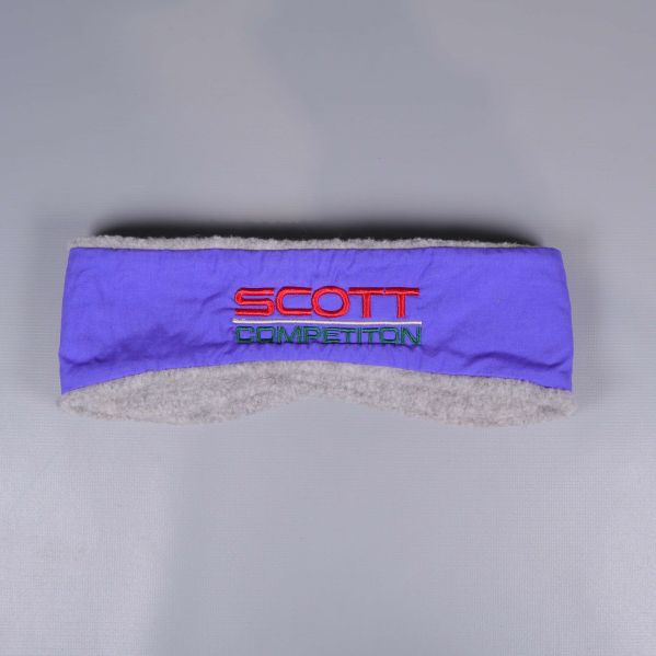 Framsidan av lila pannband med grå fleece