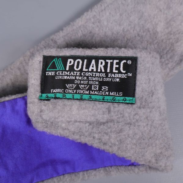 Etikett med POLARTEC-materialinformation på pannbandets insida