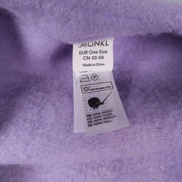 Material- och tvättrådsetikett för ljuslila basker