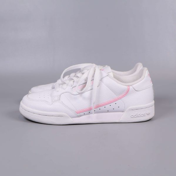Sneakers i vitt med rosa detalj, sidovy