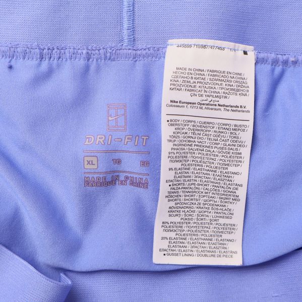 Tvättrådslapp med material- och skötselinformation