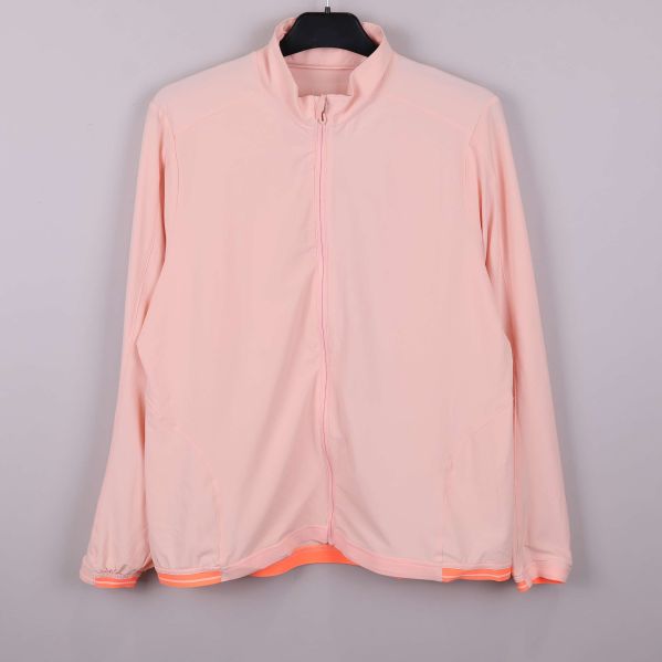 Ljus aprikos jacka med dragkedja och hög krage framifrån