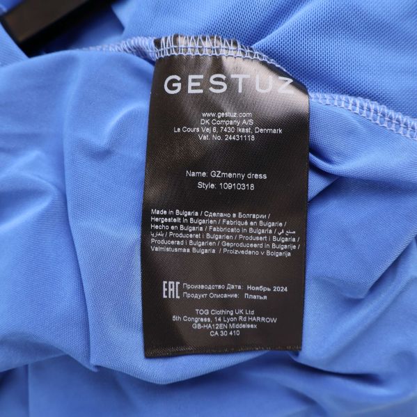 Material- och tvättlapp för Gestuz klänning