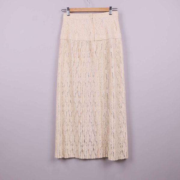 Plisserad cremefärgad spetskjol 