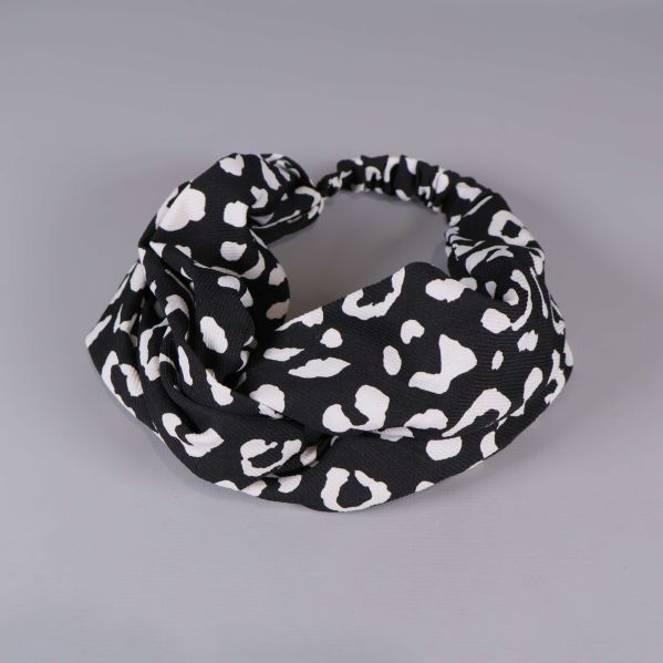 Svart hårband med vitt djurmönster i elastisk design