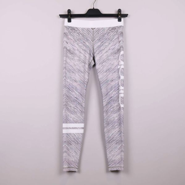 Tights med grafiskt mönster och vit linning framifrån