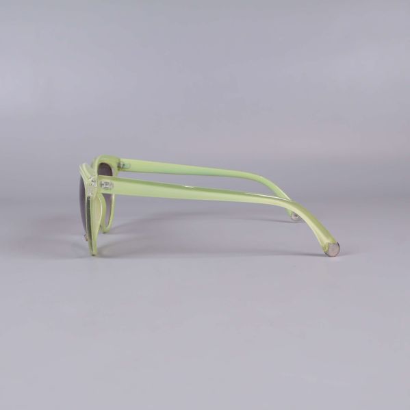 Sida av ljusgula solglasögon med smala skalmar