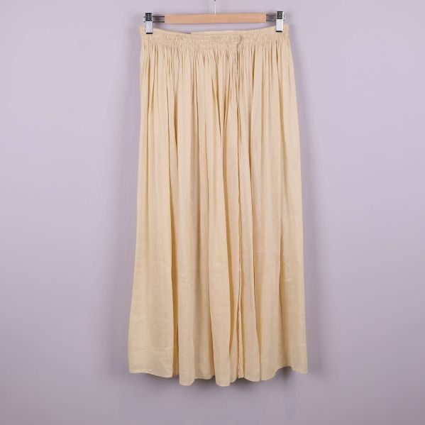 Lång gul kjol med plissering och resår i midja