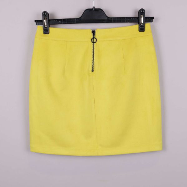 Kjol med dragkedja och ringdetalj baktill i gult tyg