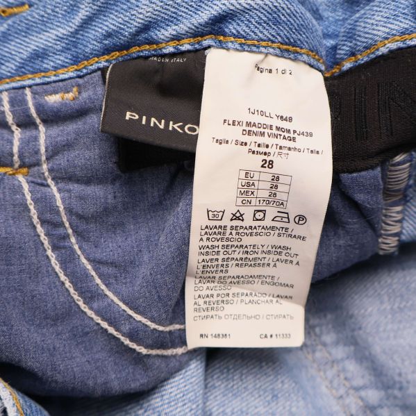 Materialetikett för Pinko jeans med storlek och skötselanvisningar