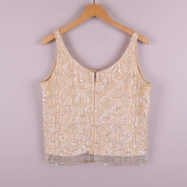 Paljettlinne med fransar, baksida