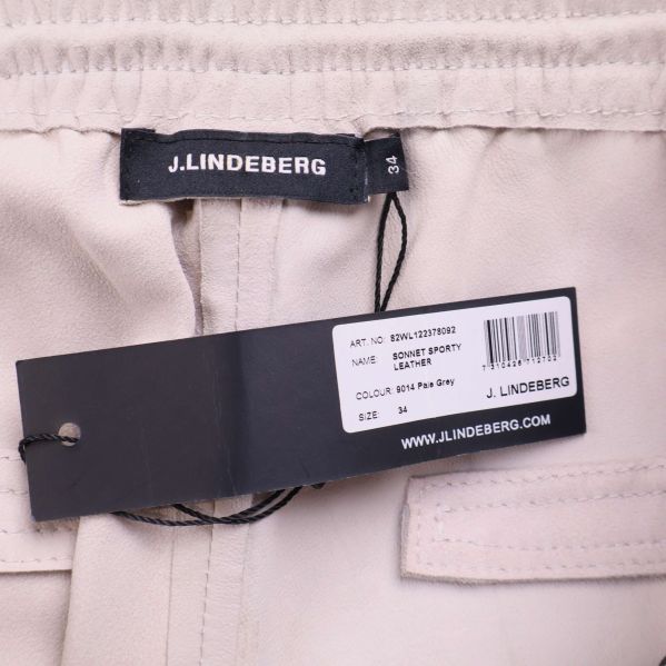 J.Lindeberg logga samt etikett med modell och färg