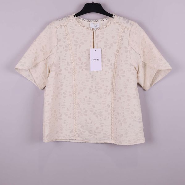 Kortärmad ljus topp på galge med strukturmönster