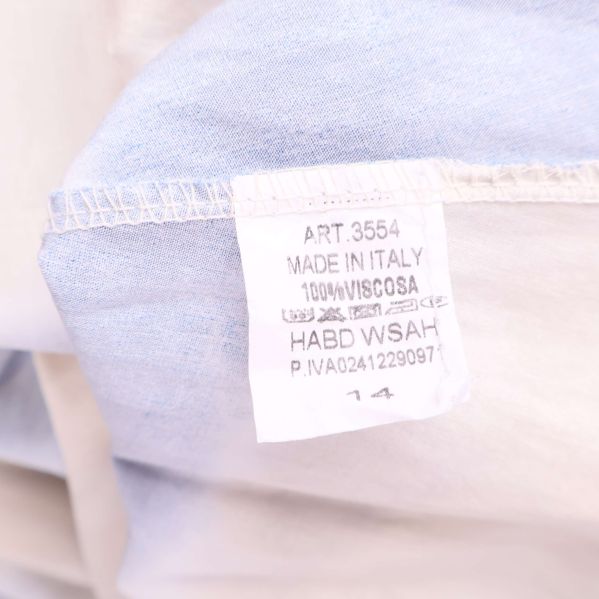 Materiallapp som visar 100% viskos tillverkad i Italien