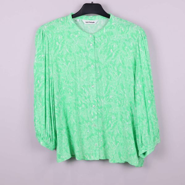 Ljusgrön blus med abstrakt mönster och vida ärmar