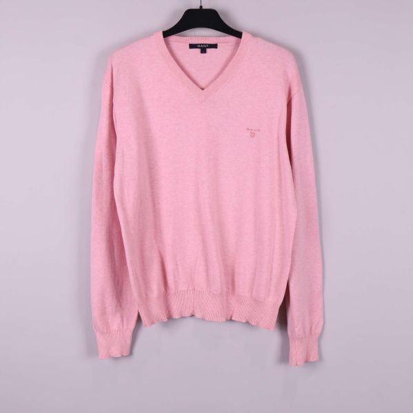 V-ringad rosa tröja med lång ärm på galge