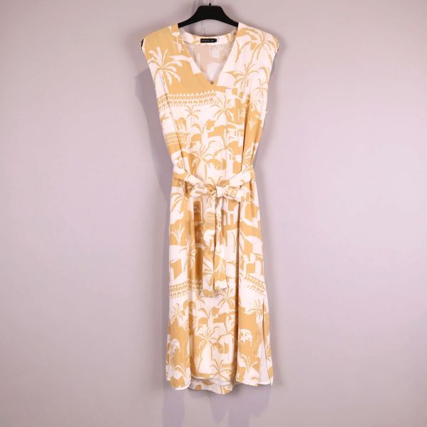 Gulvit klänning med palmträd och knytskärp framtill