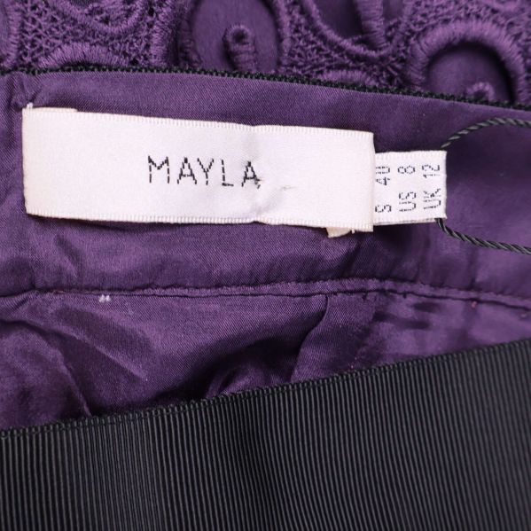 Närbild på inre Mayla-märkesetikett och storlekslapp