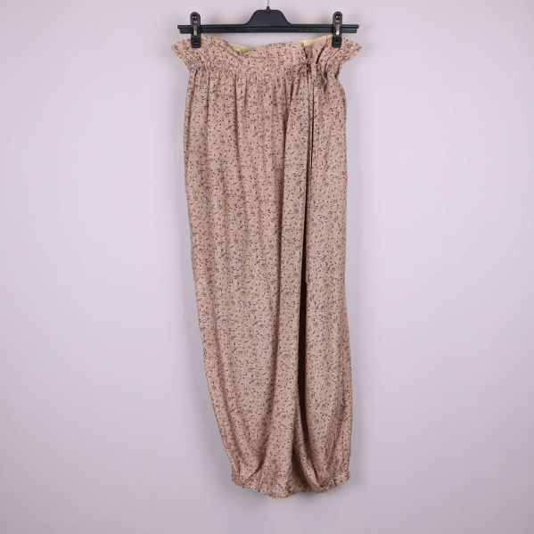 Byxor med rynkad midja och småmönstrad beige textil