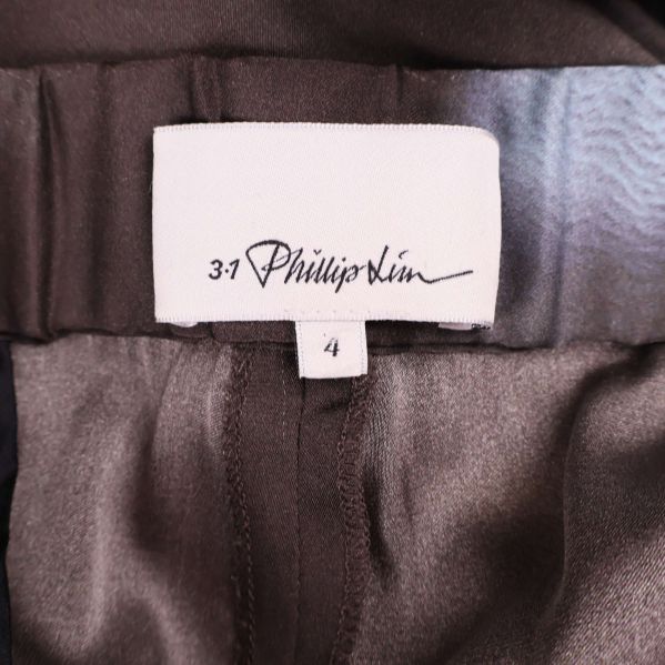 Etikett med 3.1 Phillip Lim logotyp och storlek