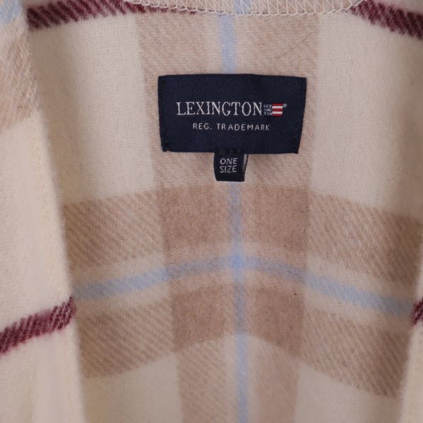 Etikett med Lexington-logo och texten one size