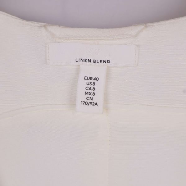 Nacketikett med storleksinformation och text linen blend