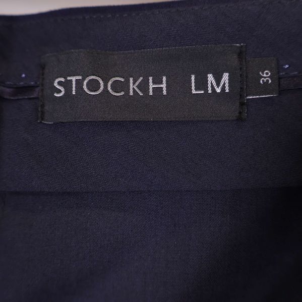 Närbild etikett Stockh LM storlek 36