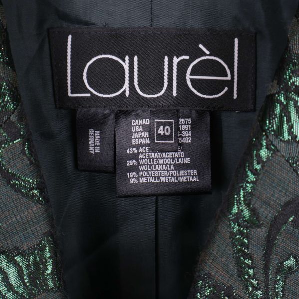 Närbild på Laurèl-märkesetikett och materiallapp i blazer
