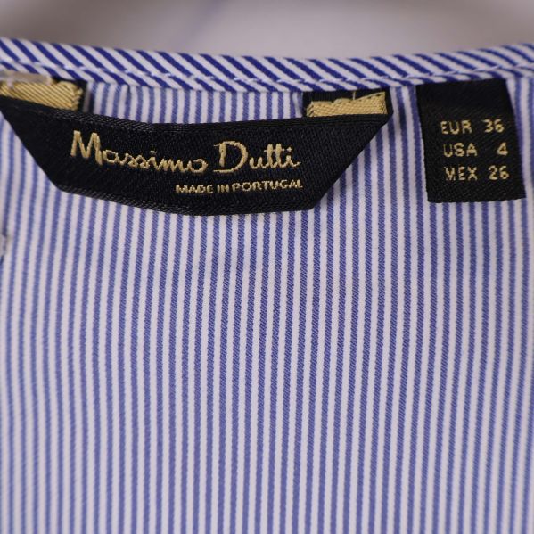 Etikett med Massimo Dutti och storlek 36 synlig