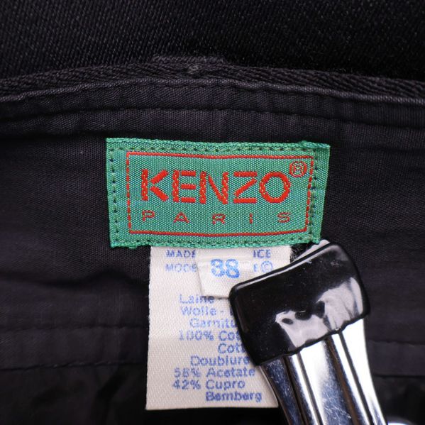 Kenzo Paris-logotyp och materialetikett på byxans insida