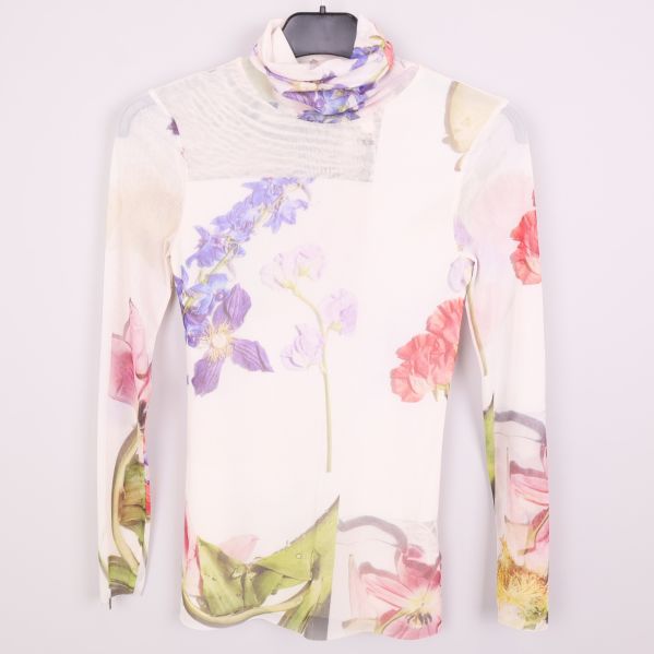 Långärmad meshpolo med blommigt tryck framifrån