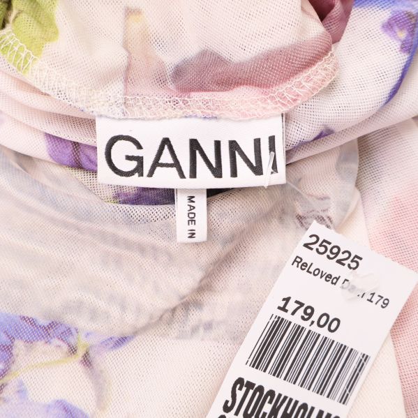 Ganni-logotyp synlig på innertag och prislapp