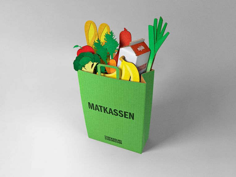 Matkasse i kartong med matvaror.